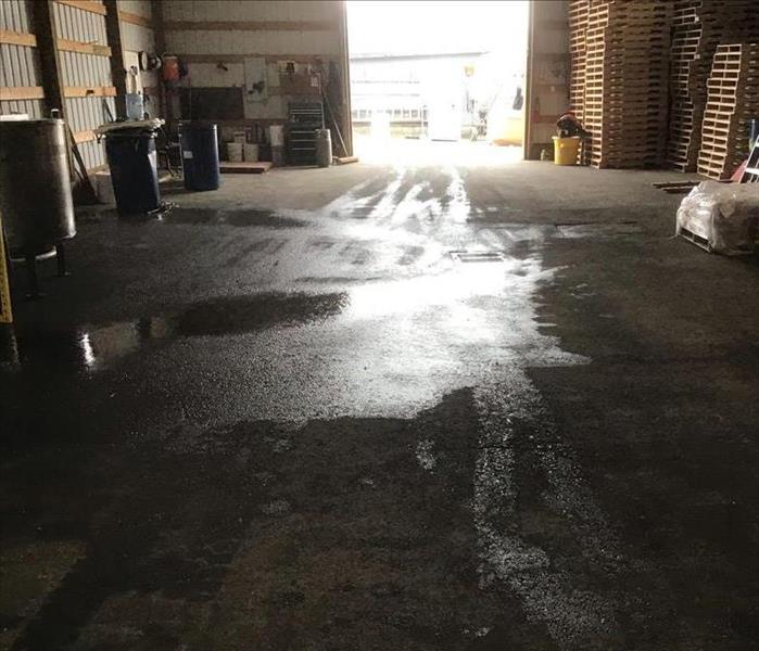 Water on the floor of a warehouse in Enumclaw, WA